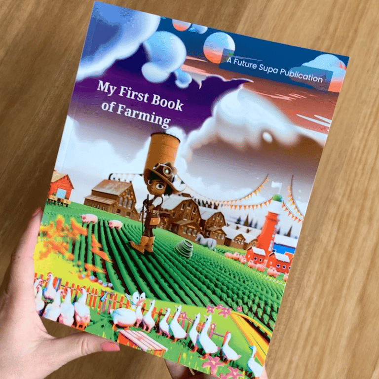 A children's picture book held in a pair of hands. Titled my first book of farming shows a digital character standing on a futuristic farm.